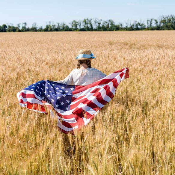 Child holding American flag